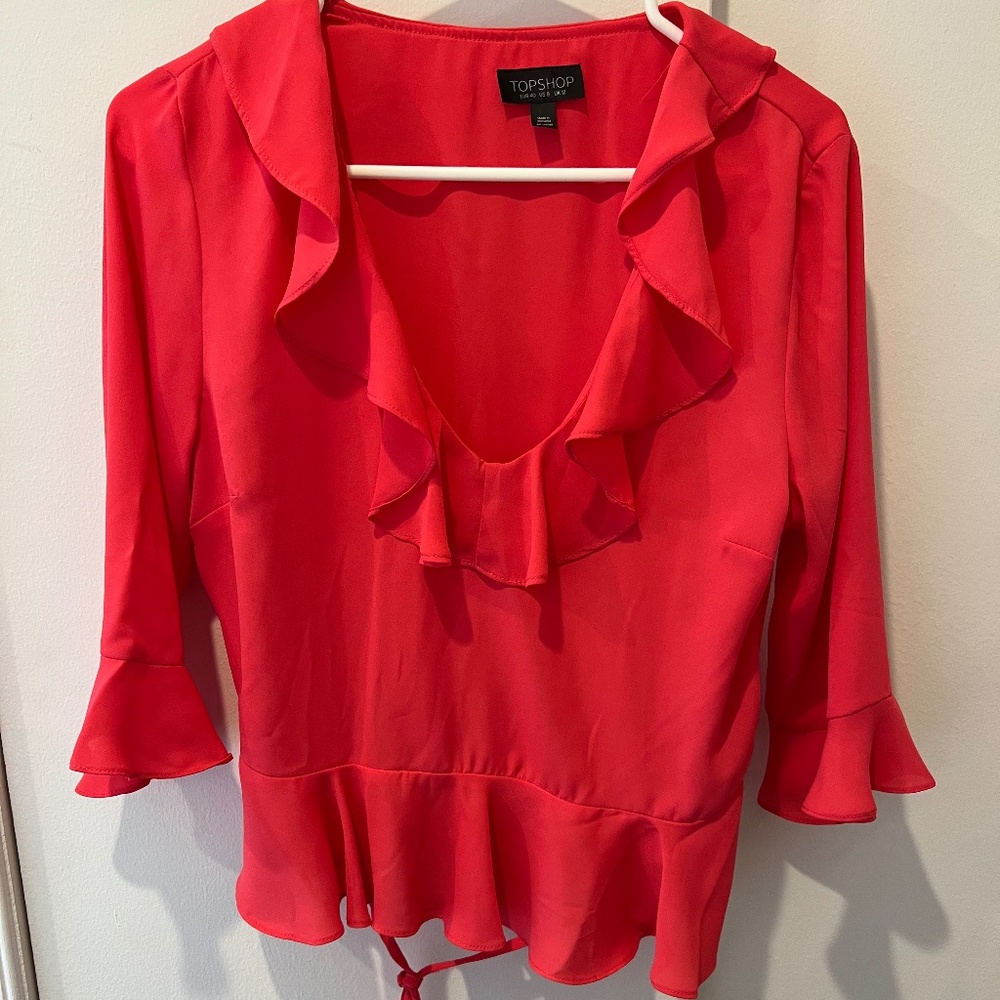 Pink blouse with ruffles